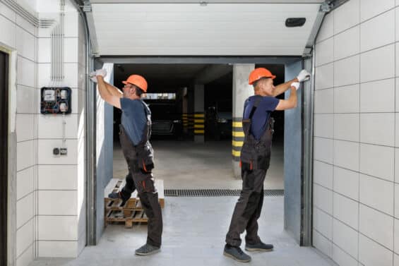 Garage door professionals installing a new insulated garage door